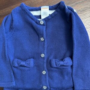 Adorable navy Blue Cardigan with Bow Pockets. Size 12-18 mos